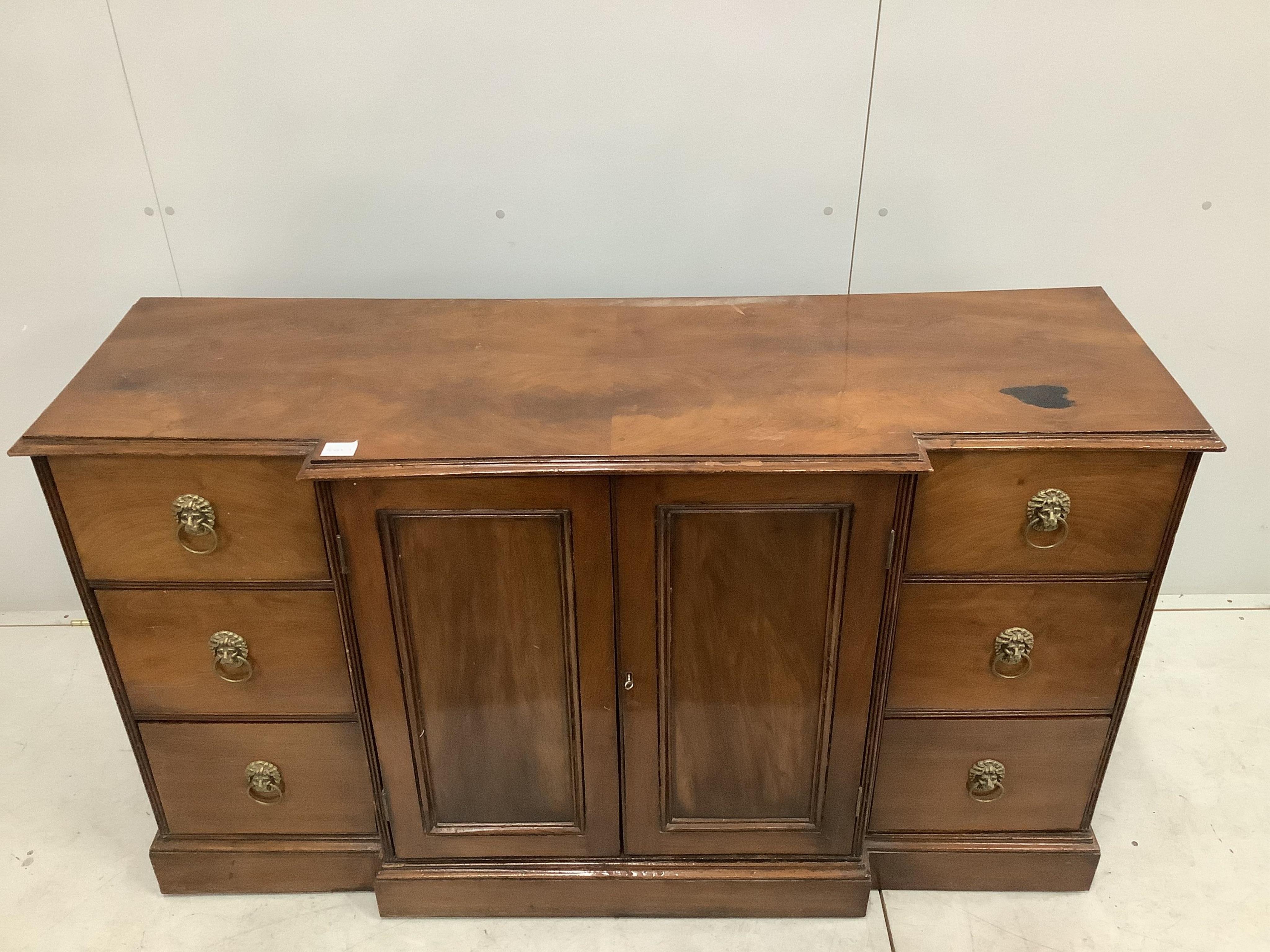 A George IV style mahogany breakfront dwarf cabinet, width 152cm, depth 49cm, height 87cm. Condition - fair, top has a large dark blemish